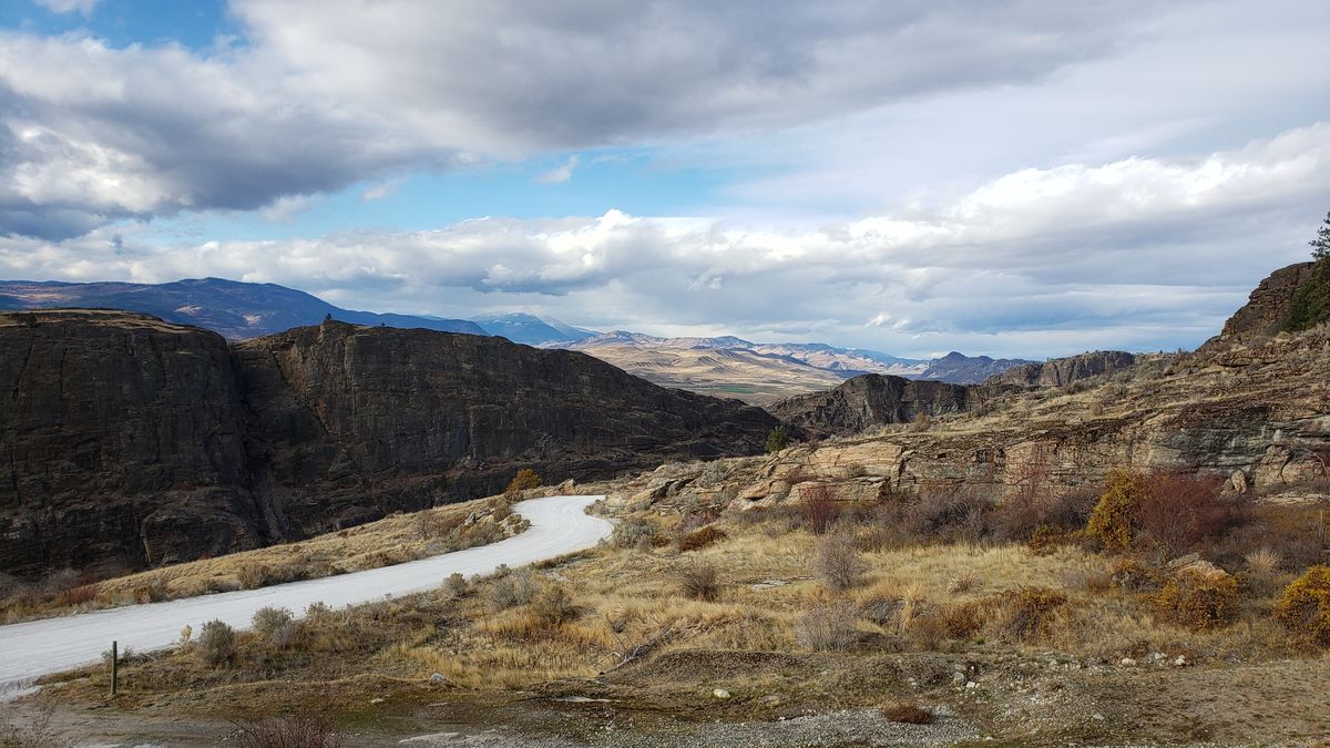 Layered gneiss rock formations at McLaughlin Canyon showing geological strata in fall